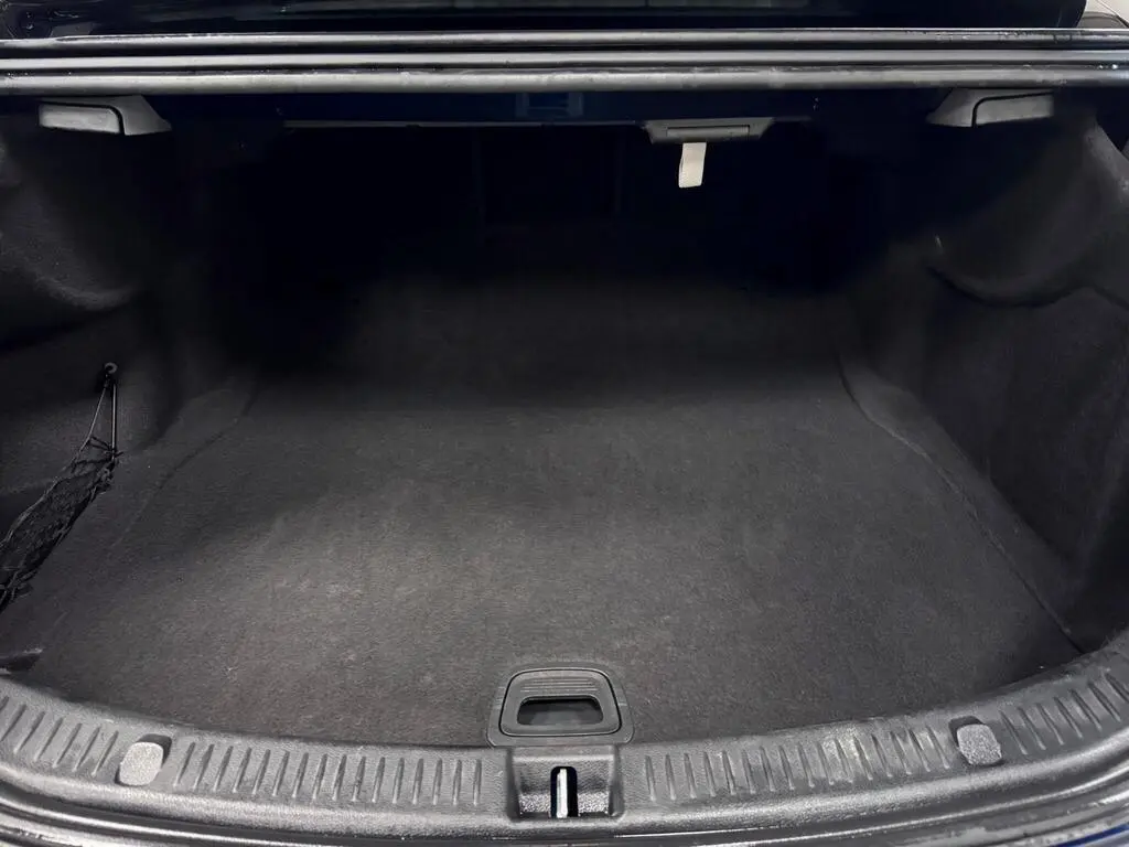 Open boot space in business-class saloon suitable for airport luggage