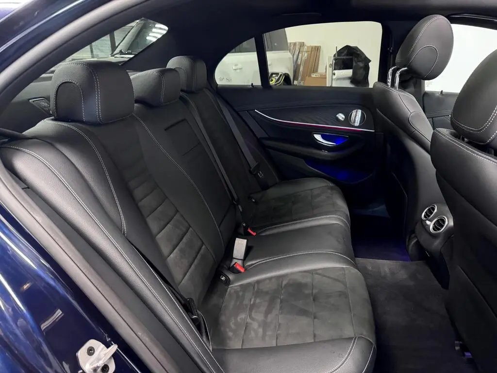 Full rear cabin in business-class car with premium stitching and legroom