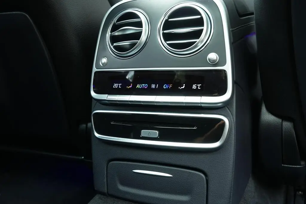 Dual-zone digital air conditioning panel in the rear of luxury vehicle